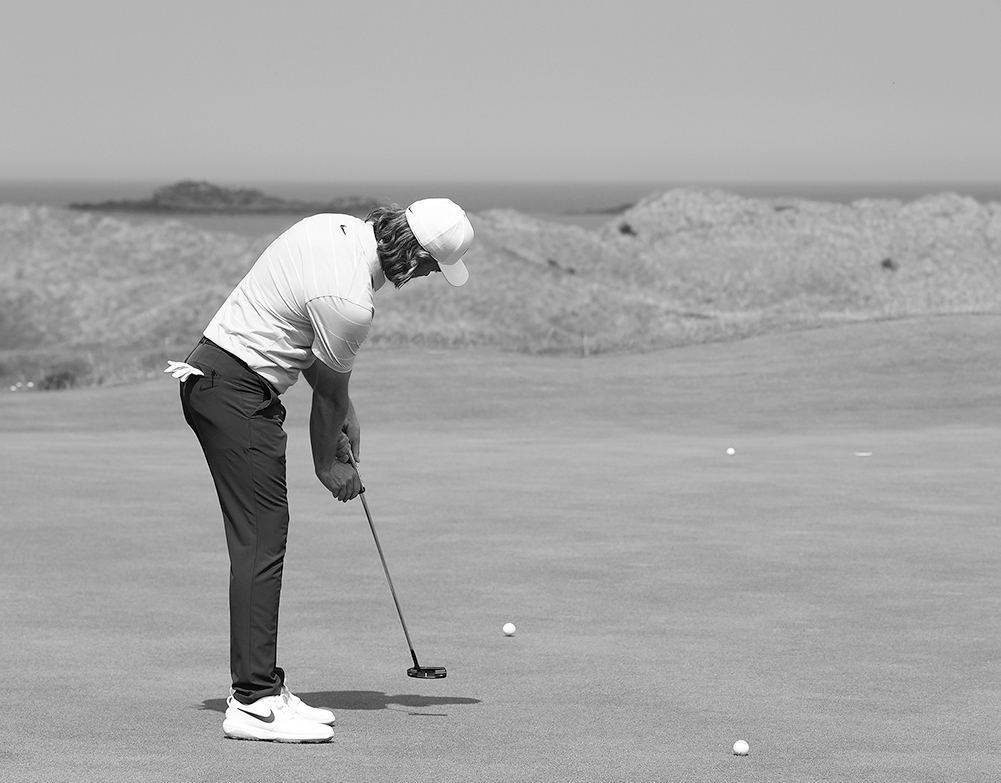 When putting, how do you promote a stable face at impact position?